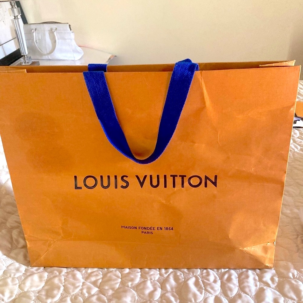 Louis Vuitton Shopping bag, and 1 receipt envelope.